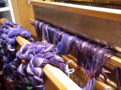 View from the front, warp chains threaded through the reed.